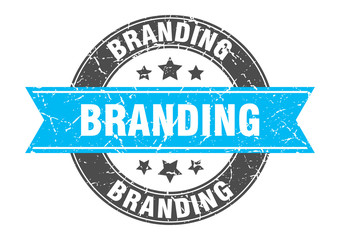 branding round stamp with turquoise ribbon. branding