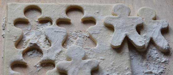 making Christmas cookies from dough