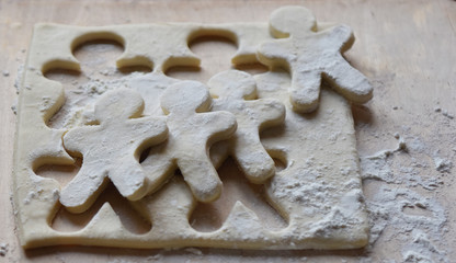 making Christmas cookies from dough