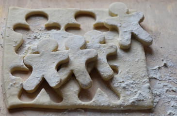making Christmas cookies from dough