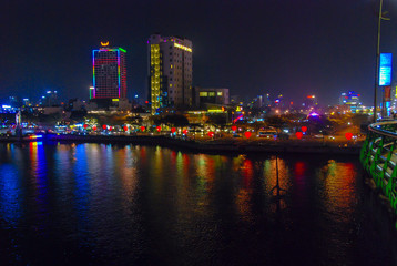 Fototapeta na wymiar View of Love Bridge from Dragon Bridge at night, Da Nang city center, Vietnam 