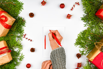Christmas composition with various objects for writing. Studio shot over christmas background....