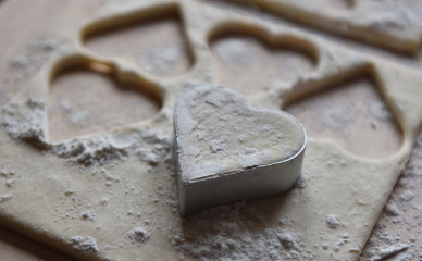 making Christmas cookies from dough