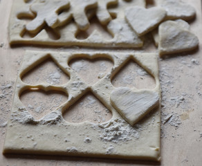 making Christmas cookies from dough