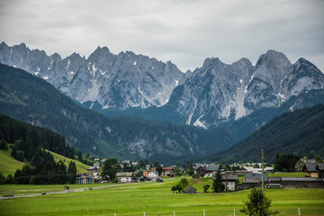 Fototapeta na wymiar Austria - July, 2019: Country road in the alps village in Austria