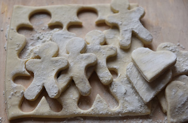 making Christmas cookies from dough
