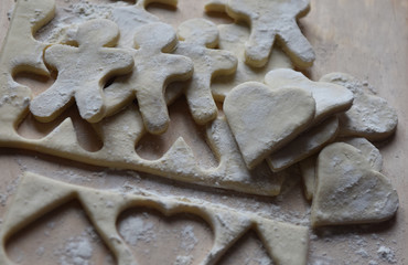making Christmas cookies from dough