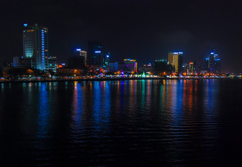 Fototapeta na wymiar Da Nang city of Vietnam illuminated at night and reflected in Han river 