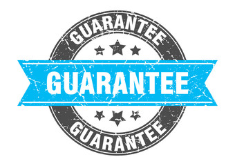 guarantee round stamp with turquoise ribbon. guarantee