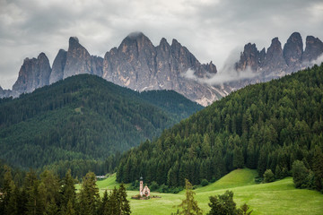 Dolomites, Italy - July, 2019: Famous best alpine place of the world, Santa Maddalena village with Dolomites mountains in background, Val di Funes valley, Trentino Alto Adige region, Italy, Europe