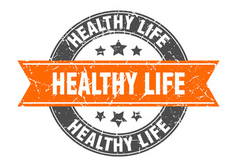 healthy life round stamp with orange ribbon. healthy life