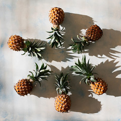 Fresh pineapples on light background.