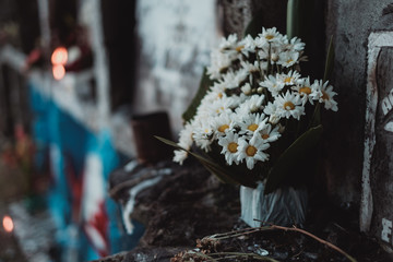 Bouquet of flowers offered or given to the dead, in one of the apartment tombstones, during a visit...