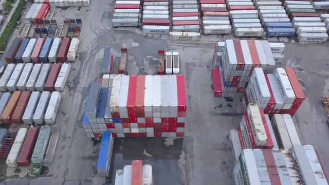 4K Aerial shot of shipping containers in terminal port. import export concept.