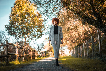 A young Dominican woman walking in autumn