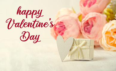 Happy Valentine's day, celebration concept. Greeting card with gift box, heart, pink flowers. gentle lovely image. soft selective focus. close up