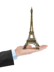 Fototapeta na wymiar Paris Eiffel tower souvenir in hand