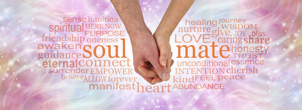 You and Me were spiritually meant to be - male and female hand in gentle embrace between the words SOUL and MATE surrounded by a relevant word cloud on a loving gentle pastel coloured background