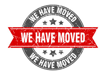 Obraz premium we have moved round stamp with red ribbon. we have moved