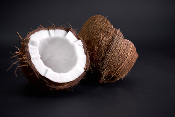 Tasty, ripe, chopped coconut on a dark background