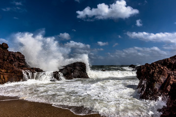 waves crashing on rocks