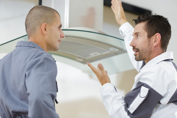 Fototapeta premium supervisor telling off his worker on installation