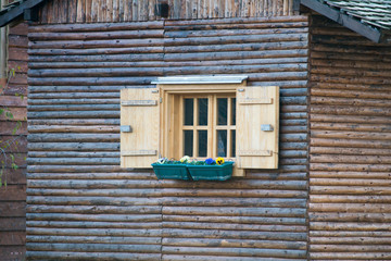 Obraz na płótnie Canvas window in an old wooden cottage