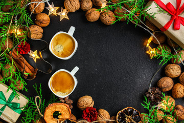 Obraz na płótnie Canvas coffee, New Year, Christmas background or Noel holiday festive (nuts, specials, decorations and gifts on the table, greeting card) menu concept. food background. copy space. Top view
