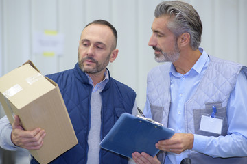 courier holding a clipboard