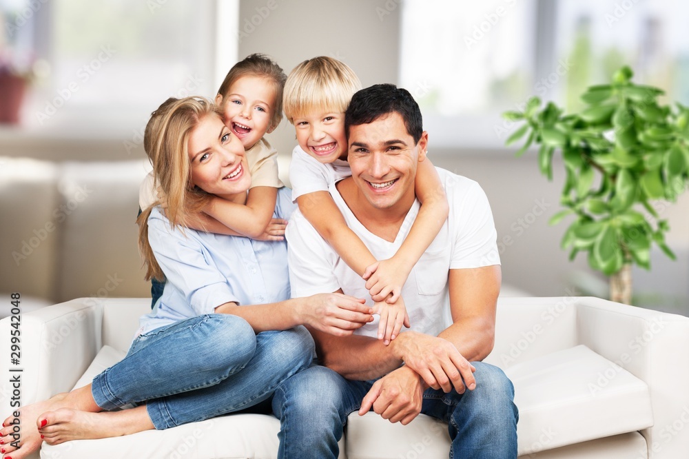 Poster young family at home smiling at camera