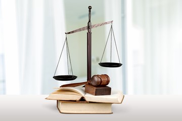 Justice Scales and books and wooden gavel on table. Justice concept