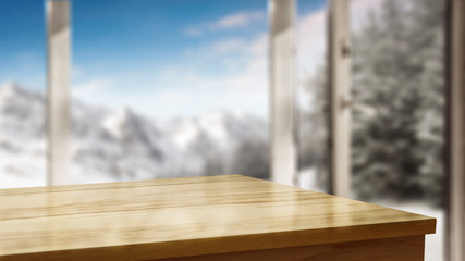 Table corner with space for your product. Blurry winter window with the door open. Beautiful landscape of snowy mountains and festive fir with snow covered branches. Place for your products or inscrip
