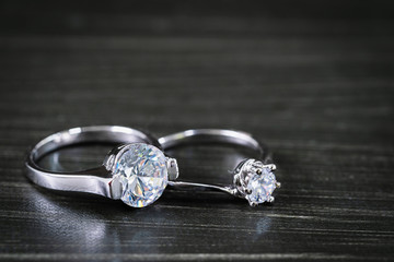Diamond wedding rings on black background