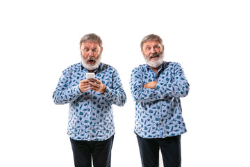 Senior man arguing with himself on white studio background. Concept of human emotions, expression,...