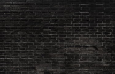 The black wall surface uses a lot of bricks. Or old black brick wall abstract pattern. Put together beautifully dark background.