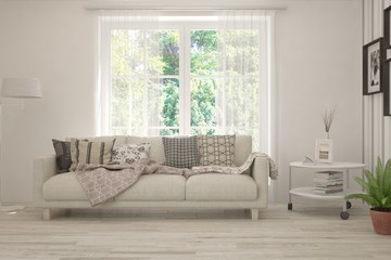 Stylish room in white color with sofa and summer landscape in window. Scandinavian interior design. 3D illustration