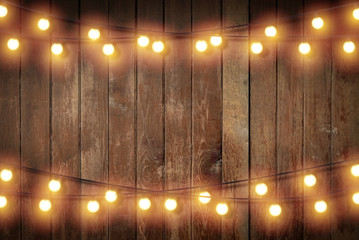 Light bulb on wooden background ,Space for your task or message.