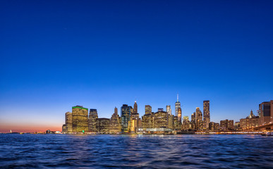 Fototapeta na wymiar Sunset view of Manhattan island skyline in New York City shot from Brooklyn
