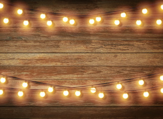 Light bulb on wooden background ,Space for your task or message.
