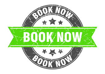 book now round stamp with green ribbon. book now