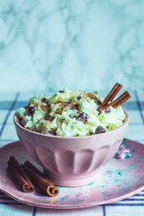traditional rice pudding with cinnamon, milk and raisins