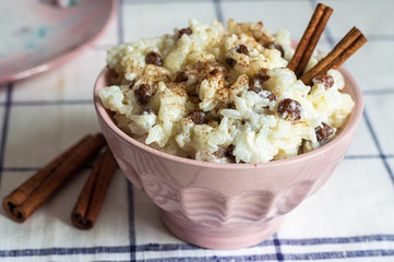 traditional rice pudding with cinnamon, milk and raisins
