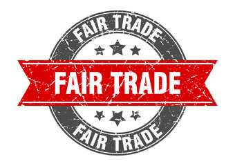 fair trade round stamp with red ribbon. fair trade