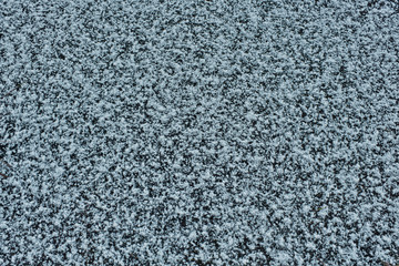 frozen water in the river. flakes of white snow and ice