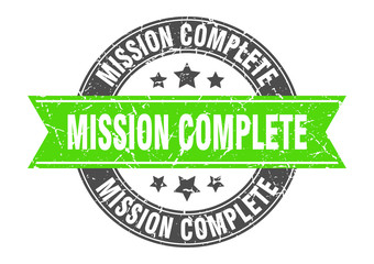mission complete round stamp with green ribbon. mission complete