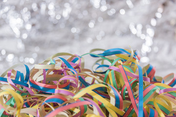 Streamers background. Simple beautiful shining background..Wooden table with paper streamers for the funny party.