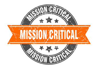 mission critical round stamp with orange ribbon. mission critical