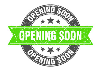 opening soon round stamp with green ribbon. opening soon