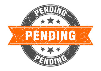 pending round stamp with orange ribbon. pending