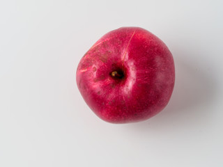Top view of organic red apple isolated on white background.